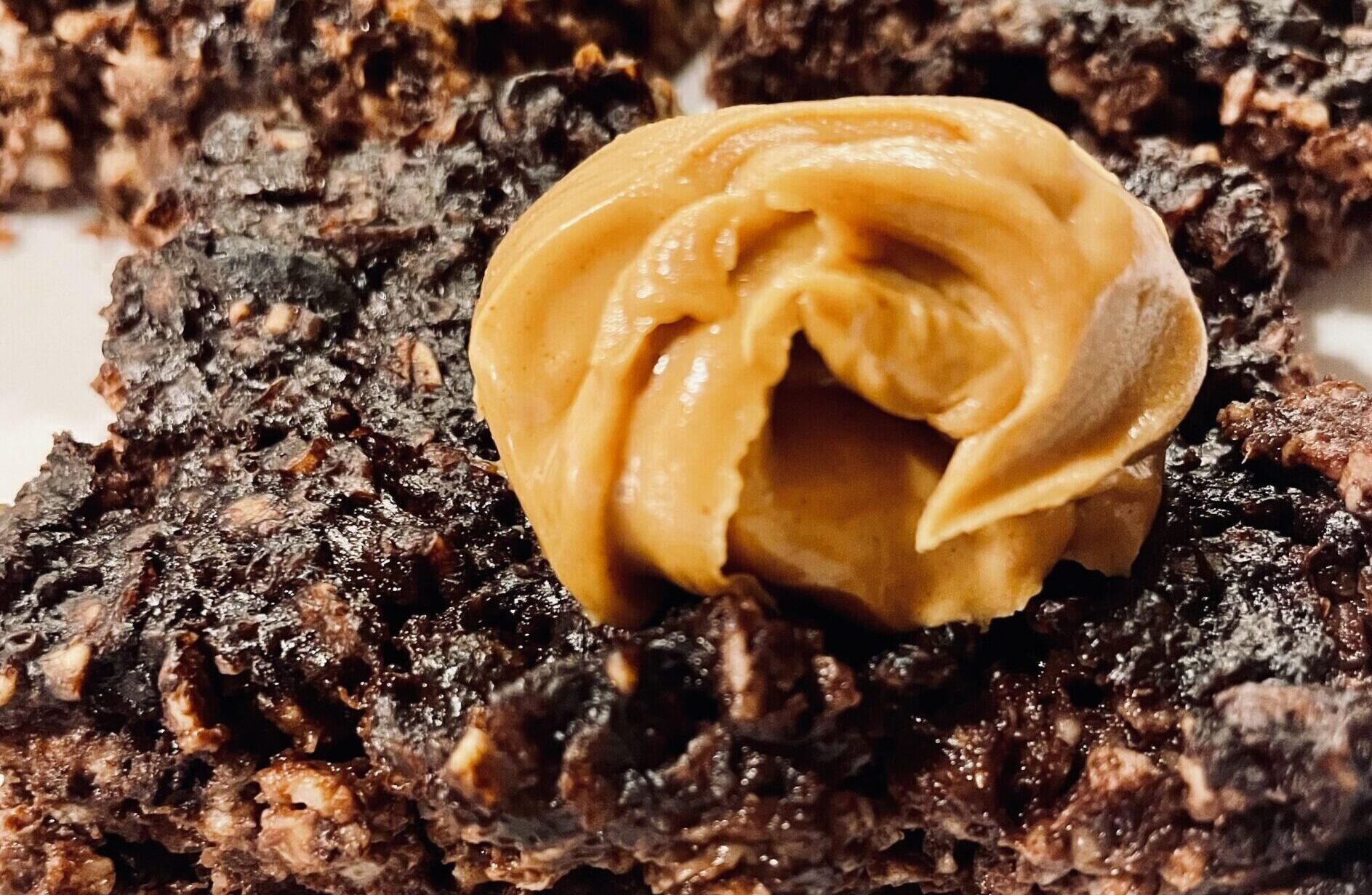 chocolate protein baked oats topped with a dollop of peanut butter.